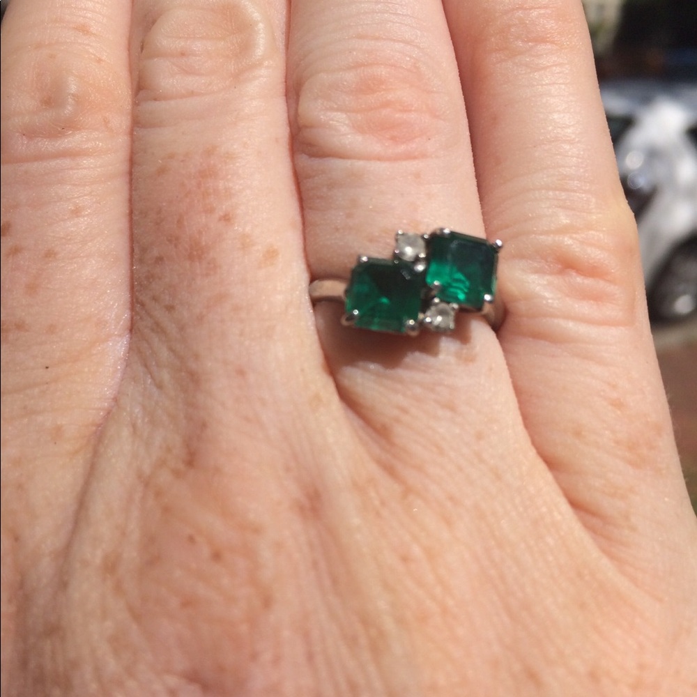 Emerald and white gold ring